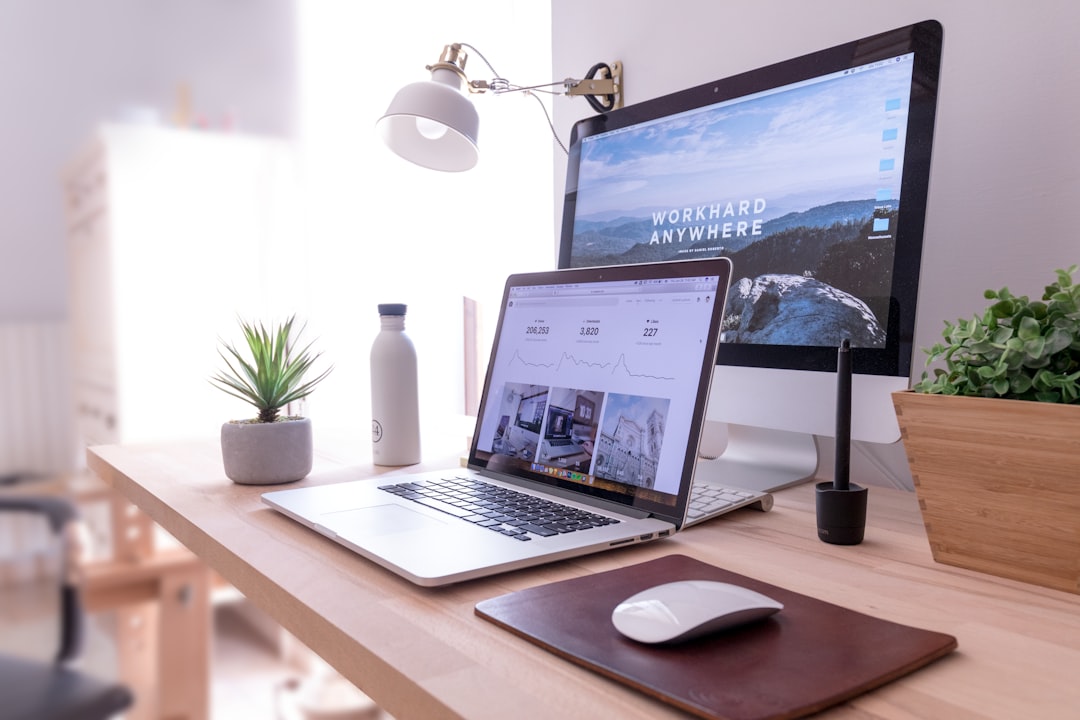 Unsplash Power by Popular Brands MacBook Pro on table beside white iMac and Magic Mouse