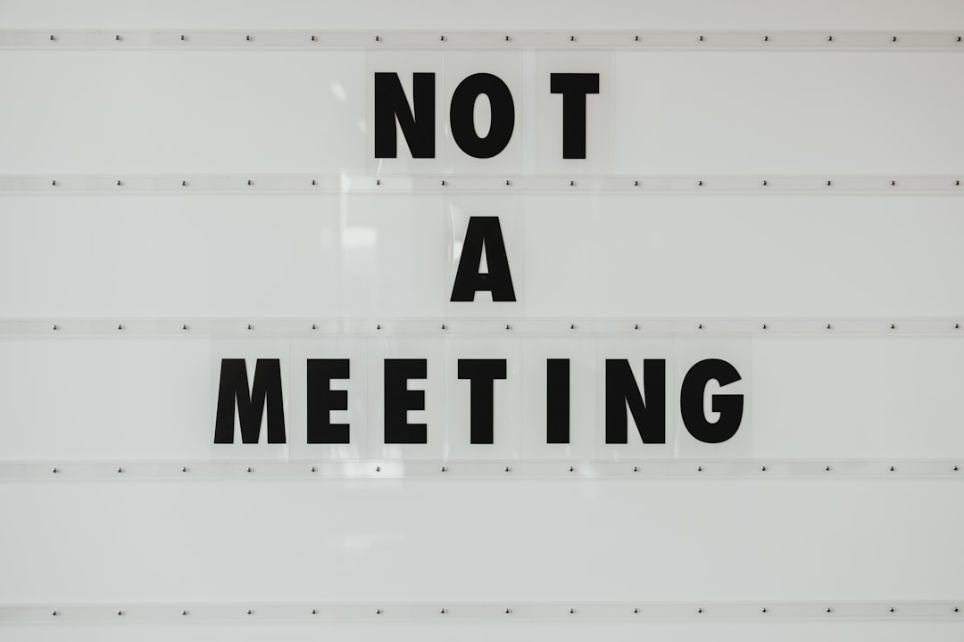 NOT A MEETING by Popular Brands black note a meeting sign on wall