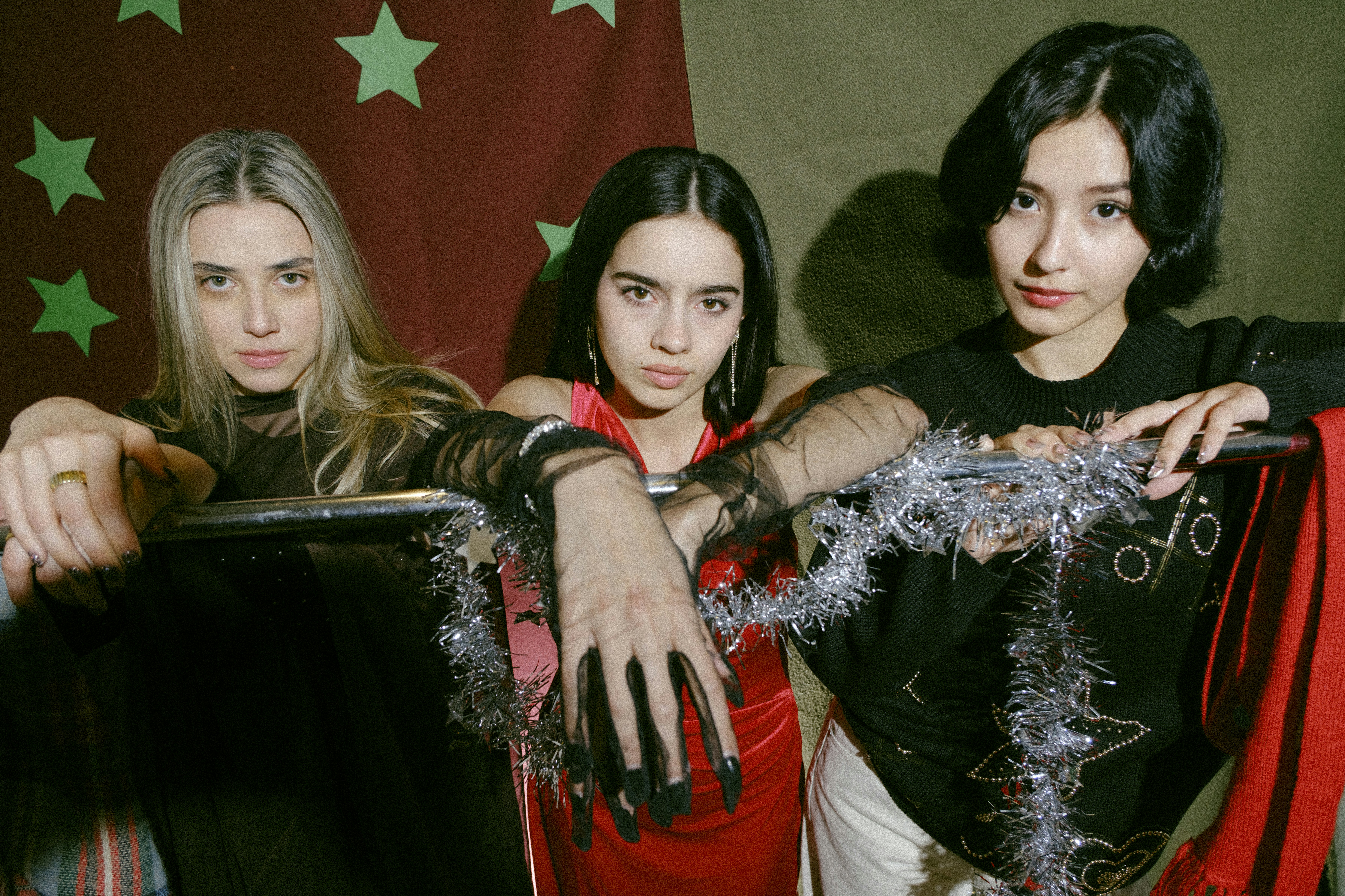 A group of young women standing next to each other